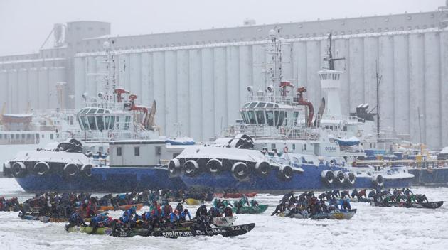 Canoers compete in the ice canoe race at the Quebec Winter Carnival in Quebec City. (REUTERS)