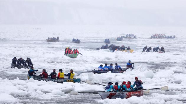 Canoers compete during the ice canoe race at the Quebec Winter Carnival in Quebec City. (REUTERS)