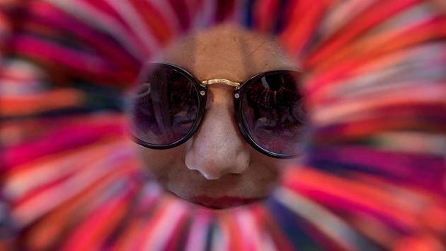 Can you see me? A women looks through an art installation put up at the KGAF 2017. (Satish Bate/HT PHOTO) 