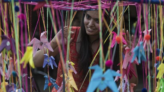 Visitors pause to experience art in all its forms at the HT Kala Ghoda Arts Festival at Cross Maidan on Sunday. (Satish Bate/HT )