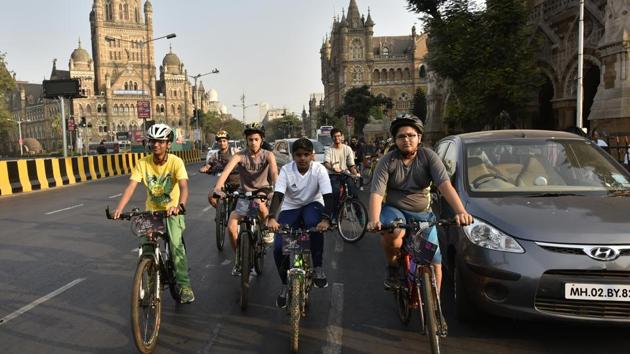 Young cyclists make their way through the historic Fort area as part of a heritage tour on Sunday. (Arijit Sen/HT )