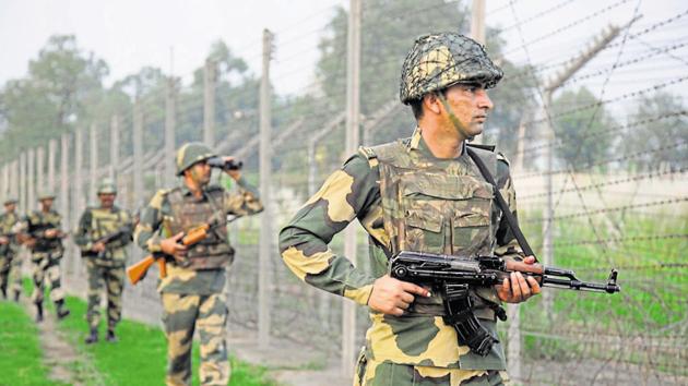 Border security force soldiers patrol near the India-Pakistan international border area. (AP photo) Border security force soldiers patrol near the India-Pakistan international border area. (AP photo)