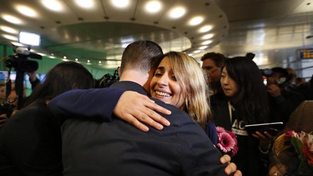 California student Sara Yarjani (R) receives a hug from a friend after arriving at the Tom Bradley International Terminal at Los Angeles International Airport on Sunday.(AP photo) California student Sara Yarjani (R) receives a hug from a friend after arriving at the Tom Bradley International Terminal at Los Angeles International Airport on Sunday.(AP photo)