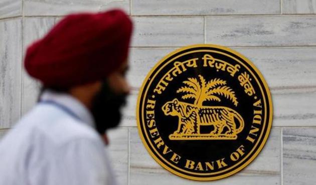 People walk past the Reserve Bank of India (RBI) head office in Mumbai. (Reuters) People walk past the Reserve Bank of India (RBI) head office in Mumbai. (Reuters)