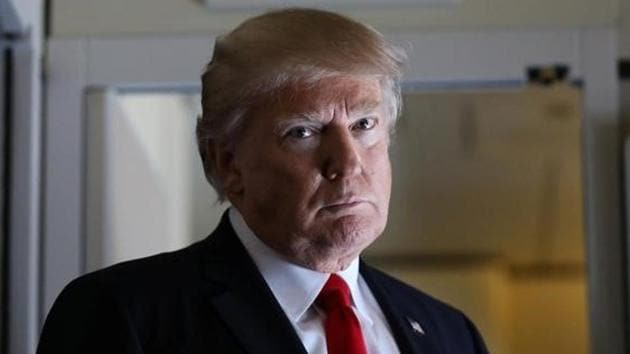US President Donald Trump pauses as he talks to journalists members of the travel pool on board the Air Force One during his trip to Palm Beach, Florida while flying over South Carolina, February 3, 2017. (Reuters)