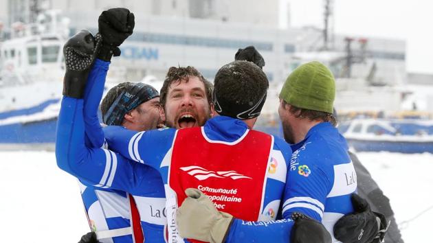 Team La Capitale celebrates after winning the men's elite division ice canoe race at the Quebec Winter Carnival in Quebec City. (REUTERS)