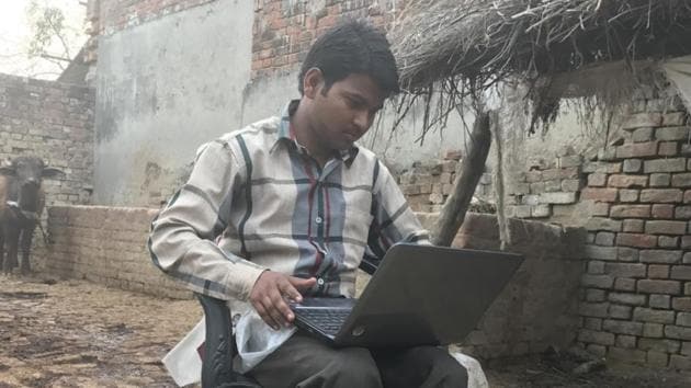 Mohammad Zakir sit with his laptop in his cowshed at Tarahia village on the outskirts of Lucknow. The free laptop scheme is one of chief minister Akhilesh Yadav’s flagship programmes. (Abhinav Rajput/HT Photo) Mohammad Zakir sit with his laptop in his cowshed at Tarahia village on the outskirts of Lucknow. The free laptop scheme is one of chief minister Akhilesh Yadav’s flagship programmes. (Abhinav Rajput/HT Photo)