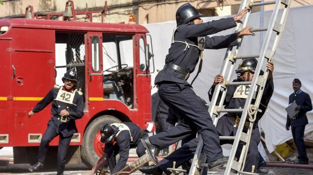 Firemen perform a rescue drill at the headquarters. (Kunal Patil/Ht photo)