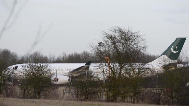 An Airbus A330 of Pakistan International Airlines on the tarmac at Stansted airport after it which was intercepted by RAF Typhoon jets after reports of a disruptive passenger onboard.(AP)