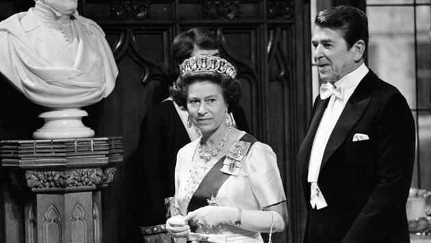 In this June 8, 1980 file photo, Britain's Queen Elizabeth II and U.S. President Ronald Reagan walk into St. George's Hall at Windsor Castle, England. On Monday Feb. 6, 2017. (AP File Photo)