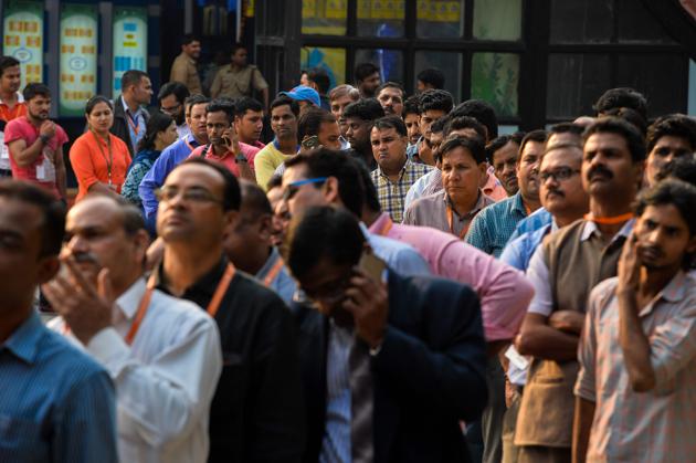 Indian people wait in a queue to withdraw money from a mobile ATM machine in New Delhi on November 15, 2016. India is to use indelible ink to prevent people from exchanging old notes more than once, the government said, a week after the withdrawal of high-value banknotes from circulation in a crackdown on "black money". (AFP) Indian people wait in a queue to withdraw money from a mobile ATM machine in New Delhi on November 15, 2016. India is to use indelible ink to prevent people from exchanging old notes more than once, the government said, a week after the withdrawal of high-value banknotes from circulation in a crackdown on "black money". (AFP)