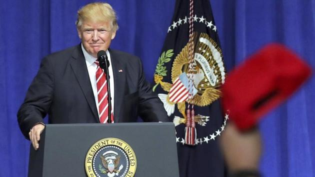 US President Donald Trump is welcomed as he speaks to commanders and coalition representatives during a visit to US Central Command and US Special Operations Command at MacDill Air Force Base in Tampa, Florida. (Reuters Photo)