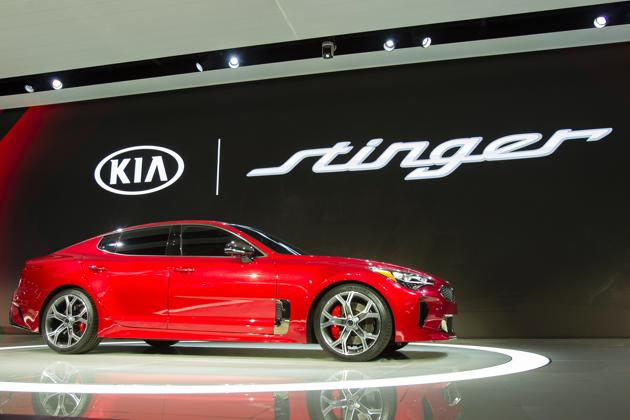 The Kia Stinger is unveiled during a press conference at the 2017 North American International Auto Show in Detroit, Michigan, January 9, 2017. / AFP PHOTO / Geoff Robins (AFP) The Kia Stinger is unveiled during a press conference at the 2017 North American International Auto Show in Detroit, Michigan, January 9, 2017. / AFP PHOTO / Geoff Robins (AFP)
