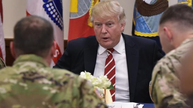 US President Donald Trump sits down for lunch with troops during a visit to the US Central Command at MacDill Air Force Base on February 6, 2017 in Tampa, Florida. (AFP) US President Donald Trump sits down for lunch with troops during a visit to the US Central Command at MacDill Air Force Base on February 6, 2017 in Tampa, Florida. (AFP)