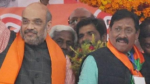 BJP National President Amit Shah with former India cricketer and BJP leader Chetan Chauhan at an election rally in Amroha.(PTI) BJP National President Amit Shah with former India cricketer and BJP leader Chetan Chauhan at an election rally in Amroha.(PTI)