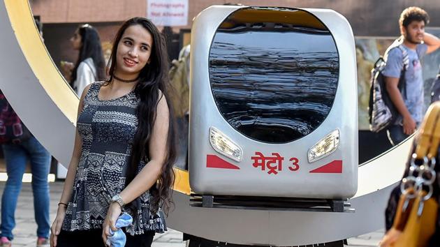A model of Metro-3 serves as unique background for a photo.  (Kunal Patil/Hindustan Times) 