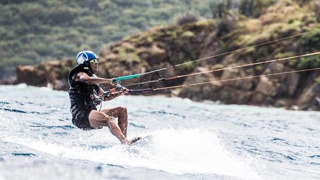 Former US president Barack Obama is pictured during a kitesurfing session with British billionaire Richard Branson, off the coast of Moskito Island in the British Virgin Islands in the Caribbean.(AFP Photo)