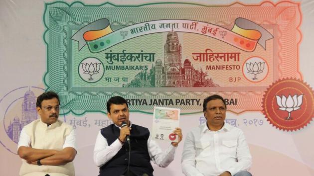 Chief minister Devendra Fadnavis (centre), Mumbai BJP president Ashish Shelar (right) and education minister Vinod Tawde release the party's manifesto on Tuesday. (Bhushan Koyande) Chief minister Devendra Fadnavis (centre), Mumbai BJP president Ashish Shelar (right) and education minister Vinod Tawde release the party's manifesto on Tuesday. (Bhushan Koyande)