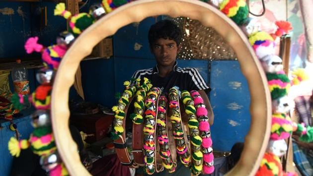 A boy displays decorative necklaces for bulls ahead of the Jallikattu bull taming event, in Madurai on February 7, 2017. People are gearing up for Jallikattu that will be conducted as per schedule at Alanganallur on February 10. (ARUN SANKAR / AFP)