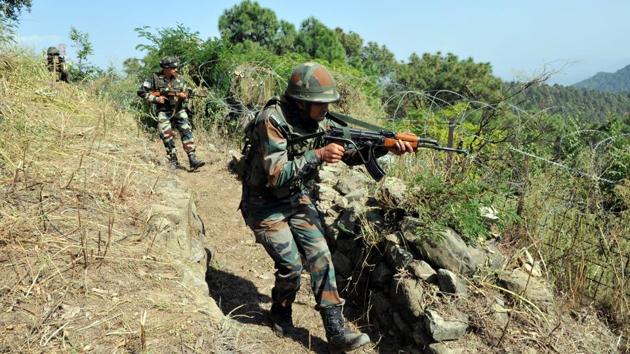 Soldiers in position near the Line of Control in Nowshera sector, Jammu and Kashmir, following repeated ceasefire violations since September 2016.(Nitin Kanotra /HT File Photo)