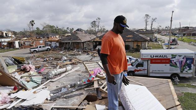 Solomon Singleton looks at the damage from the second story of a friend's home a day after a tornado touched down in eastern New Orleans, on February 8, 2017. (AP Photo) Solomon Singleton looks at the damage from the second story of a friend's home a day after a tornado touched down in eastern New Orleans, on February 8, 2017. (AP Photo)