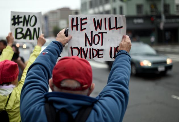 Protesters hold up signs in front of the United States Court of Appeals for the Ninth Circuit in San Francisco, California on Tuesday. (AFP) Protesters hold up signs in front of the United States Court of Appeals for the Ninth Circuit in San Francisco, California on Tuesday. (AFP)
