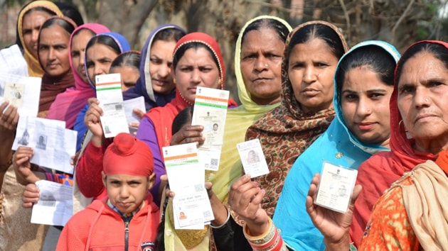 Voters showing their ID cards before casting vote during the re-polling at a polling station in Majitha constituency in Amritsar on Thursday. (Gurpreet Singh/HT Photo) Voters showing their ID cards before casting vote during the re-polling at a polling station in Majitha constituency in Amritsar on Thursday. (Gurpreet Singh/HT Photo)