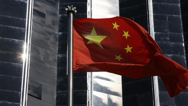 File photo of a Chinese flag hoisted outside a commercial building in Shenzhen in southern Guangdong province.(Reuters)
