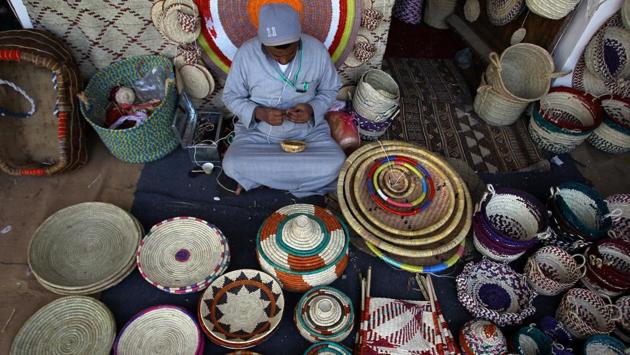 A man makes handmade ornamental products during the festival, which Saudi Arabia uses as an occasion to promote tourism. (Faisal Al Nasser / REUTERS)