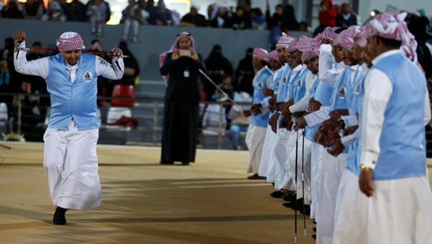 Saudi men perform a traditional dance during the festival. (Faisal Al Nasser / REUTERS)
