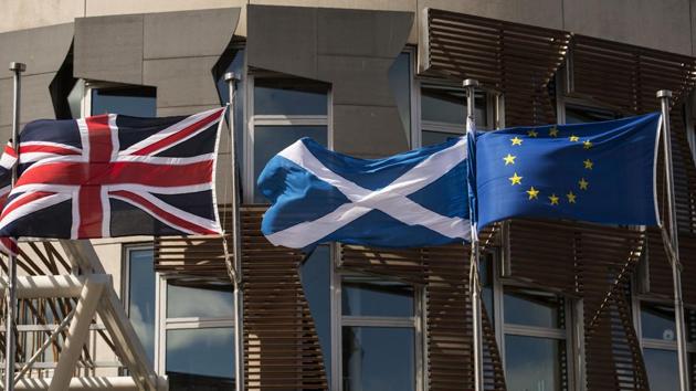 A Scottish Saltire (centre) flies between a Union flag (left) and a European Union flag.(AFP File) A Scottish Saltire (centre) flies between a Union flag (left) and a European Union flag.(AFP File)