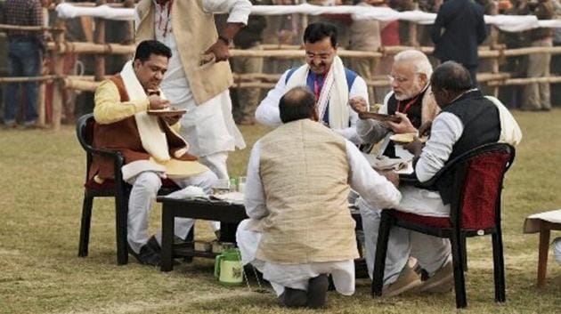 Prime Minister Narendra Modi has lunch with other BJP leaders at a meeting of party workers at DLW Ground in Varanasi . The BJP is hoping to ride on Modi’s star power to attract voters. (PTI)