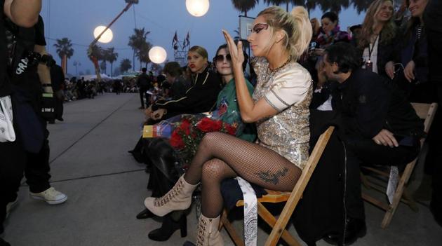 Did you notice the dragon tattoo on her left thigh? We love her beige boots. (Reuters)