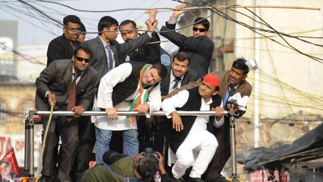 Congress vice president Rahul Gandhi and chief minister of Uttar Pradesh, Akhilesh Yadav duck under electric wires during their Lucknow, road show. The Akhilesh-Rahul alliance is one of the biggest outcomes of this election. (Deepak Gupta / HT photo )