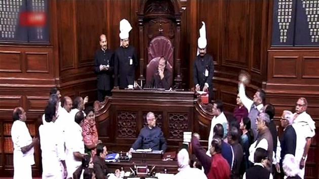Opposition members protest in the Rajya Sabha during the Budget session of Parliament in New Delhi on Thursday. (TV GRAB) (PTI) Opposition members protest in the Rajya Sabha during the Budget session of Parliament in New Delhi on Thursday. (TV GRAB) (PTI)