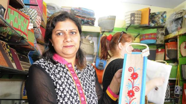 Anjali Singh, a woman entrepreneur who runs the NGO Jute Artisans Guild Association; village women tailoring jute bags.(Deepak Gupta/ HT Photo)