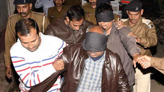 Members of the special investigation team with the arrested accused of BSSC paper leak case, in Patna. (Santosh/HT Photo) Members of the special investigation team with the arrested accused of BSSC paper leak case, in Patna. (Santosh/HT Photo)