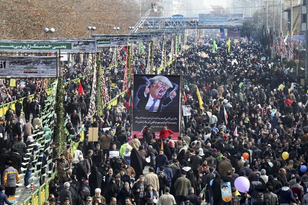 Iranians carry a banner showing a caricature of US President Donald Trump during an annual rally in Tehran on Friday commemorating the 1979 Islamic revolution. (AP) Iranians carry a banner showing a caricature of US President Donald Trump during an annual rally in Tehran on Friday commemorating the 1979 Islamic revolution. (AP)