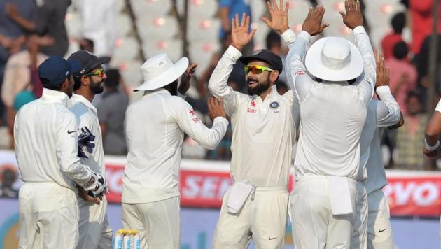 India captain Virat Kohli celebrates with teammates the wicket of Bangladesh's Soumya Sarkar on Day 2 of the Hyderabad Test on Friday. Live streaming and live cricket score of India vs Bangladesh is available online.(AFP)