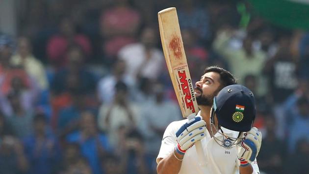 Virat Kohli celebrates after completing his double century against Bangladesh in Hyderabad.(BCCI)