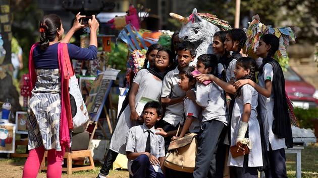 Schoolchildren pose for a photo at the Kala Ghoda Arts Festival in Mumbai. (Arijit Sen/HT PHOTO) 