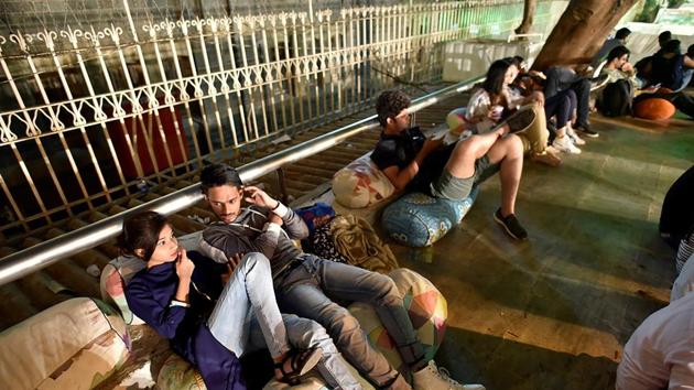 Youngsters take a breather  at the festival. (Arijit Sen/HT PHOTO) 