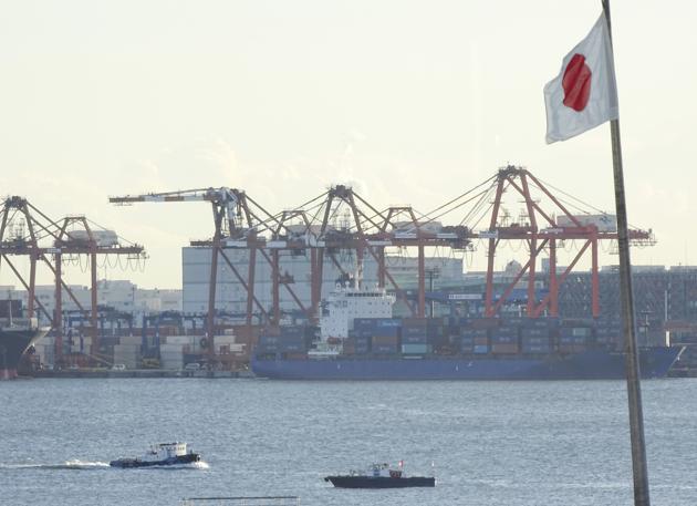 FILE - In this Wednesday, Jan. 25, 2017, file photo, a tug boat goes by the pier of a container terminal in Tokyo.(AP)