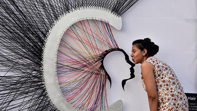 A youngster  admires the art on display at Cross Maidan. (Anshuman Poyrekar/HT PHOTO) 