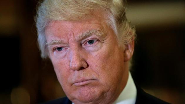 US President-elect Donald Trump listens to questions from reporters in New York. (Reuters) US President-elect Donald Trump listens to questions from reporters in New York. (Reuters)