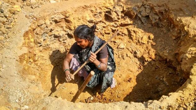Sushila Khurkute digs to construct two toilets at Nandgaon in Palghar. (HT PHOTO) Sushila Khurkute digs to construct two toilets at Nandgaon in Palghar. (HT PHOTO)