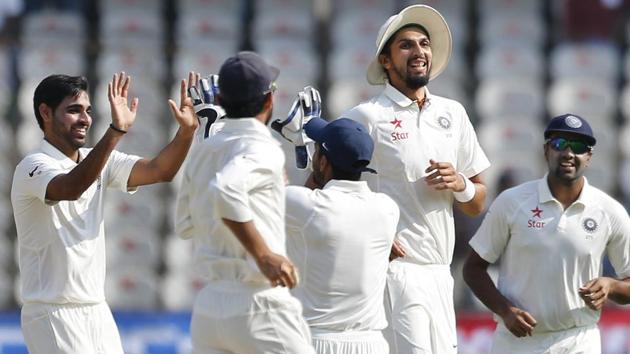 India's Bhuvneshwar Kumar, left, celebrates with teammates the dismissal of Bangladesh's Tamim Iqbal. (AP)