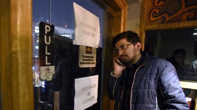A customer at My Bar HQ, which is 21 Connaught Place restaurants partly sealed after a portion of a building collapsed in C block. (Sonu Mehta/HT Photo) A customer at My Bar HQ, which is 21 Connaught Place restaurants partly sealed after a portion of a building collapsed in C block. (Sonu Mehta/HT Photo)