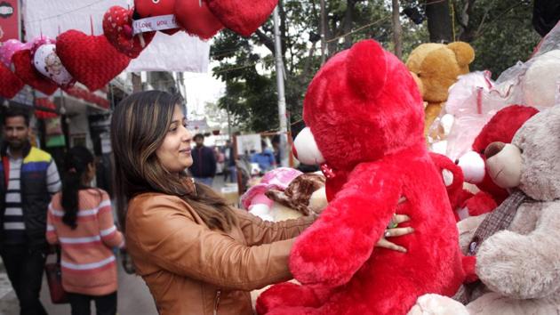 A girl looking at a teddy bear during valentine’s week in a gift shop in Mohali . (Sushil Prajapati/HT Photo)