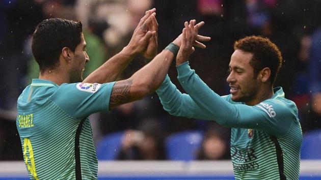 FC Barcelona's Luis Suarez and Neymar (R) celebrate scoring a goal against Deportivo Alaves in La Liga on Saturday. REUTERS/Vincent West (REUTERS) FC Barcelona's Luis Suarez and Neymar (R) celebrate scoring a goal against Deportivo Alaves in La Liga on Saturday. REUTERS/Vincent West (REUTERS)